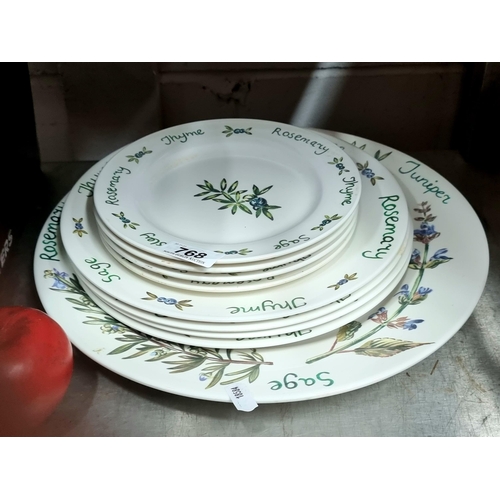 768 - A large selection of vintage plastic tableware including plates, saucers and a larger serving plate ... 