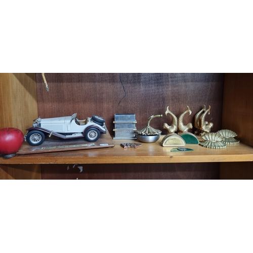 771 - A mixed lot including a model of a 1928 Mercedes Benz SSK car, a pewter ashtray, and four sets of br... 