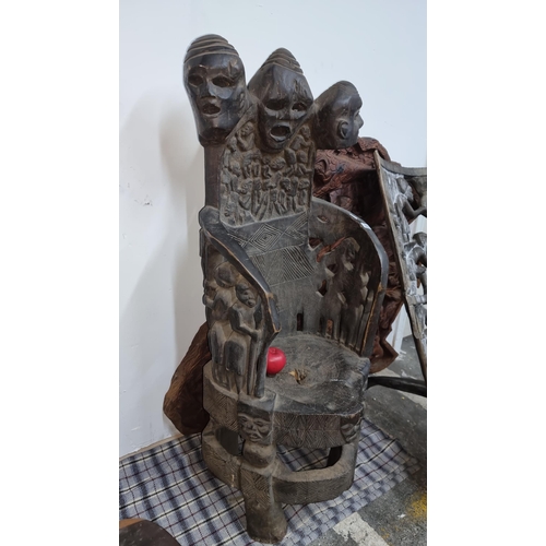 810 - Star Lot : A marvelous and very heavy African carved wooden Bamileke tribal chiefs armchair featurin... 