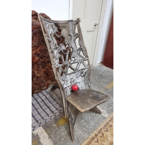 811 - Star Lot : A wonderful and very heavy African carved wooden birthing chair with figurative motifs to... 