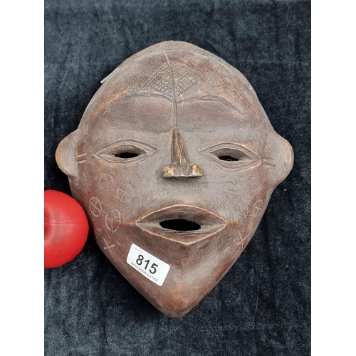 815 - Star Lot : An incredible antique hand carved African Dan mask with narrow eye and mouth slits, featu... 