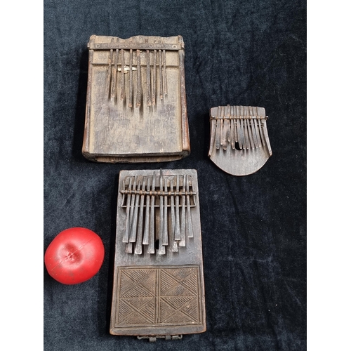 819 - Star Lot : Three antique hand made African Kalimba instruments of varying sizes. The kalimba is an A... 