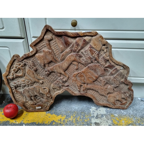 822 - A fabulous hand carved African wooden wall plaque in the form of the continent of Africa, featuring ... 