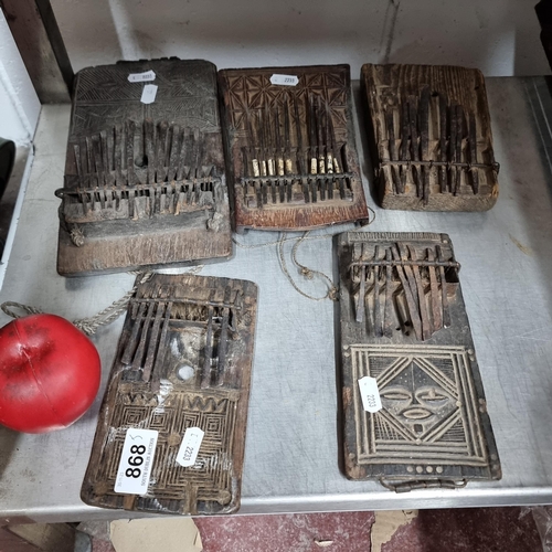 868 - Star Lot : A wonderful collection of five antique beautifully detailed Kalimba instruments.