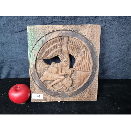 874 - A wonderful hand carved East African plaque depicting a young women preparing a meal.