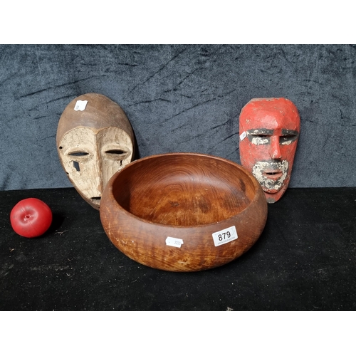 879 - Three African tribal items including a Lega Bwami mask. Simple, abstract shape of the white face wit... 