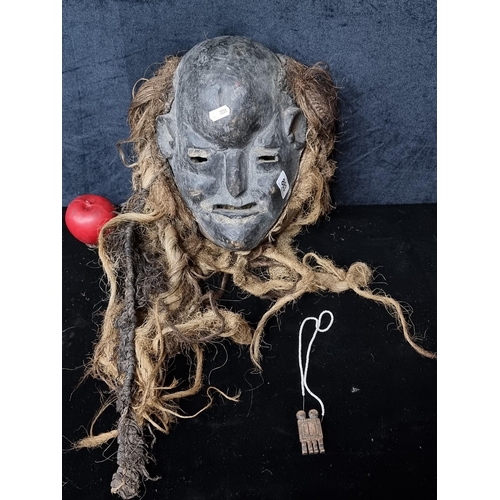 883 - Star lot : An African antique tribal Dan mask featuring rope weaving and dreadlock hair. The Dan Peo... 