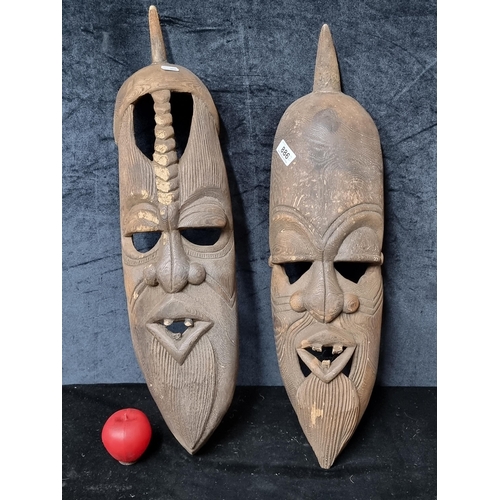 Star lot : Two antique tribal  large East African Maasai tribal wall hanging masks. Hand carved from a single piece of hardwood.