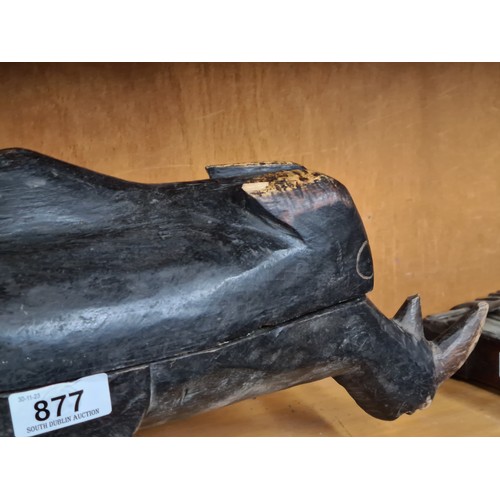 877 - A large beautifully carved African serving trough in the form of a rhino. missing one leg. Top remov... 