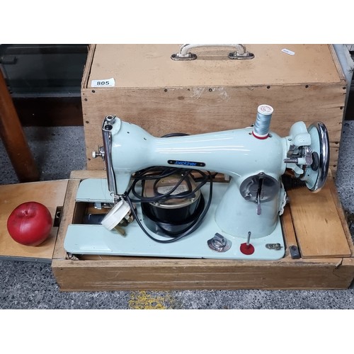 805 - A Mid Century Brother sewing machine with motor, pedal and original wooden carrier. In a lovely mint... 