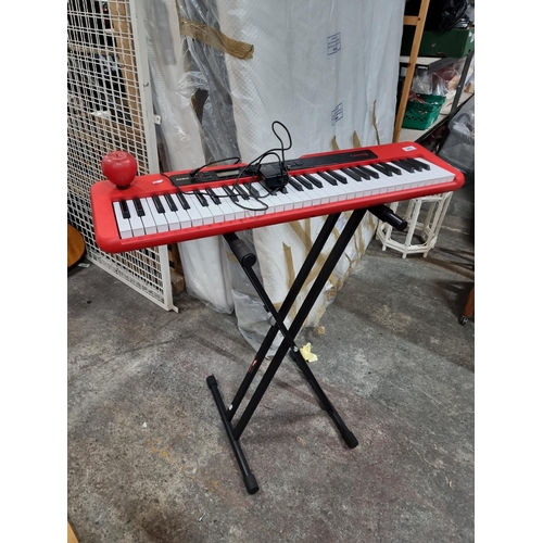 940 - A Casio portable keyboard model Casiotone CT-S200. Accompanied by a foldable Apex Tone stand. With R... 