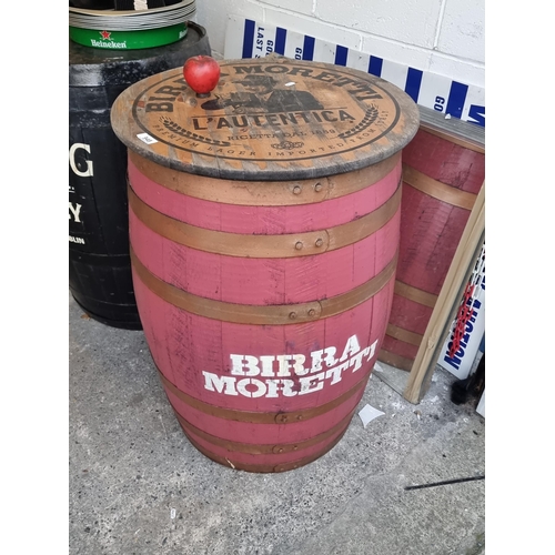 948 - A full size Birra Moretti beer barrel with a table top and metal banding. Great piece for commercial... 