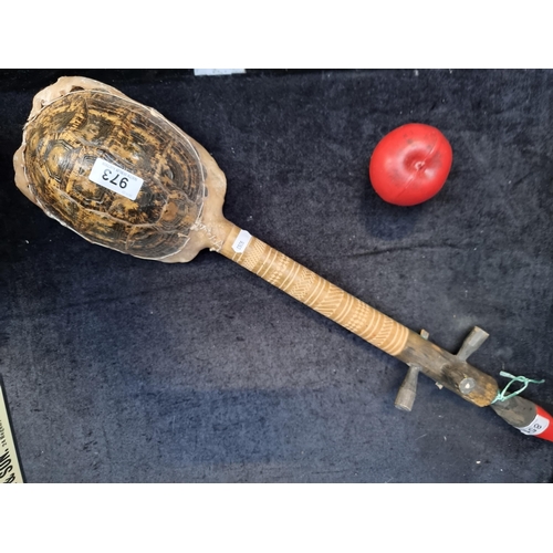 973 - A rare vintage long neck stringed instrument with a genuine turtle drum to base. Featuring three tun... 