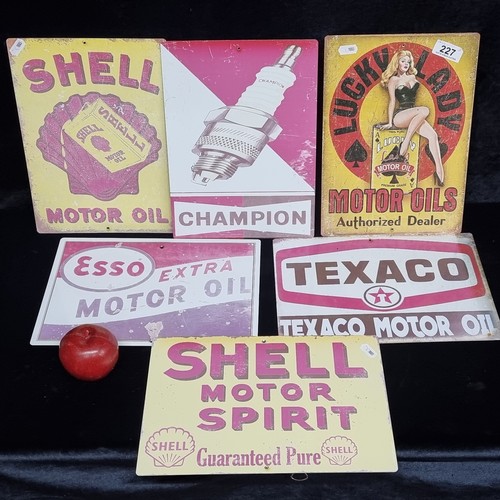 227 - A selection of a six metal gas station advertising signs including Shell, Champion and Esso.