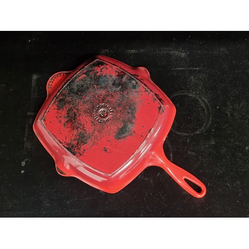 138 - A high quality Le Creuset cast iron grill skillet in a red finish.