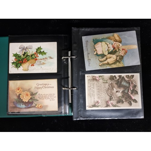 186 - A postcard album containing a large collection of approx. 156 antique and vintage Christmas postcard... 