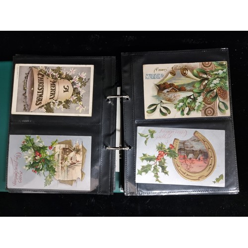 186 - A postcard album containing a large collection of approx. 156 antique and vintage Christmas postcard... 