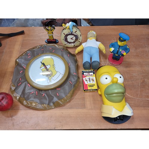 337 - A fab collection of The Simpsons themed collectables including a fun inflatable donut wall clock, a ... 