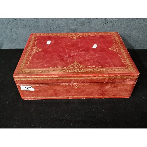 777 - A beautiful red and gold leaf embossed leather bound jewelry box with red velvet interior.