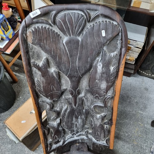 809 - Star Lot : A wonderful and very heavy African carved wooden birthing chair with beautiful bird and f... 