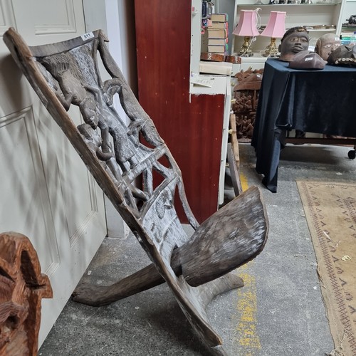 811 - Star Lot : A wonderful and very heavy African carved wooden birthing chair with figurative motifs to... 