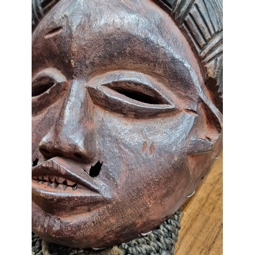 875 - Star Lot : An outstanding antique tribal example of Pwo, a classic Chokwe mask genre that honors fou... 