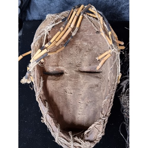 894 - Star lot : An antique tribal hand carved African Chokwe mask, originating to Angola. The mask depict... 