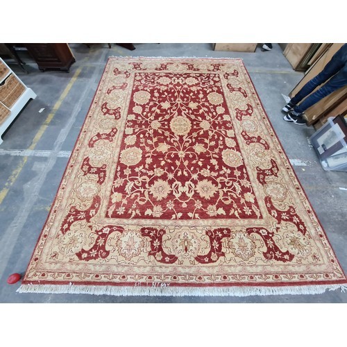 992 - Star Lot : An incredibly very large hand knotted woolen rug featuring a delicate foliate pattern in ... 