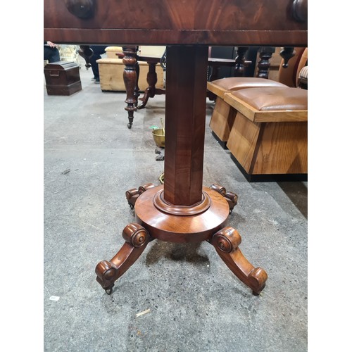 710 - Star Lot : A lovely Victorian table with a drawer and a pillar base held on four legs with ceramic c... 