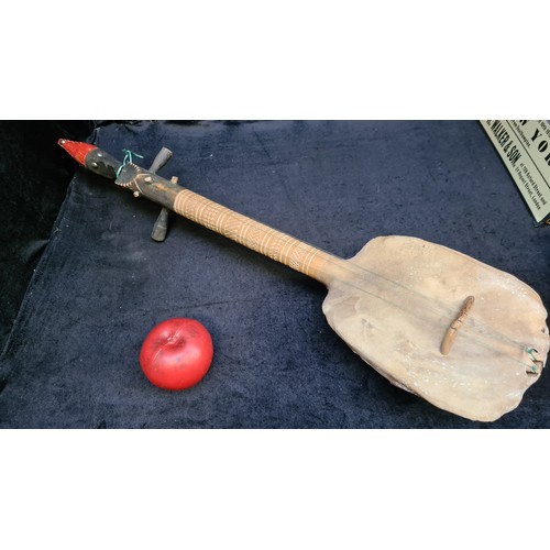 973 - A rare vintage long neck stringed instrument with a genuine turtle drum to base. Featuring three tun... 