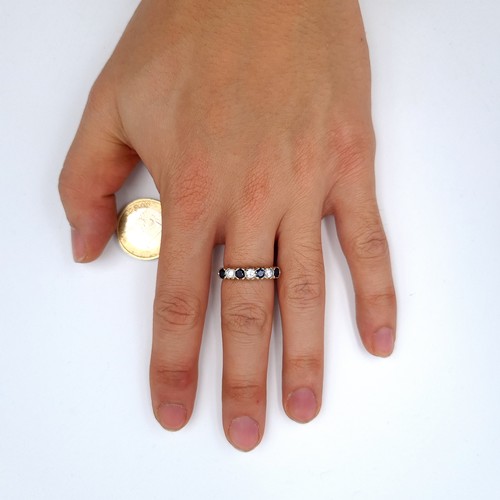 1 - A very attractive 9K gold, seven stone gem set ring, ring size O, weight 2.94 grams. Boxed.