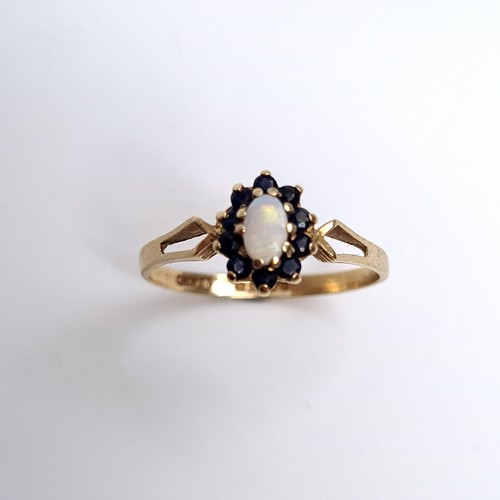 19 - A vintage 9K gold opal and sapphire ring, ring size Q, weight 1.51 grams. Boxed.