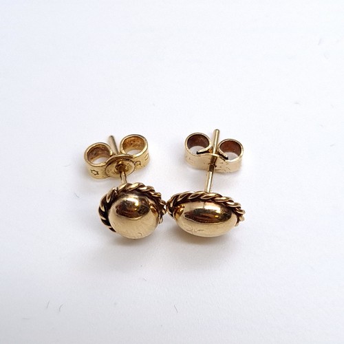 21 - A pair of 9K gold dome set design stud earrings. Boxed.