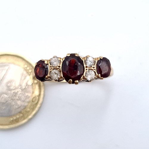 514 - A fine 9K gold vintage garnet and gem set ring, ring size U, weight 2.5 grams.