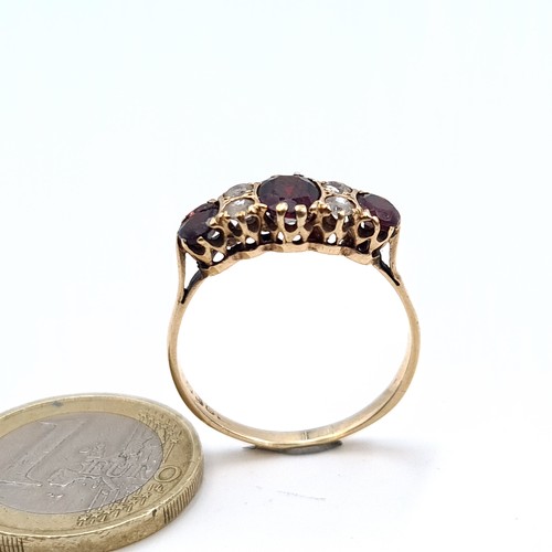 514 - A fine 9K gold vintage garnet and gem set ring, ring size U, weight 2.5 grams.