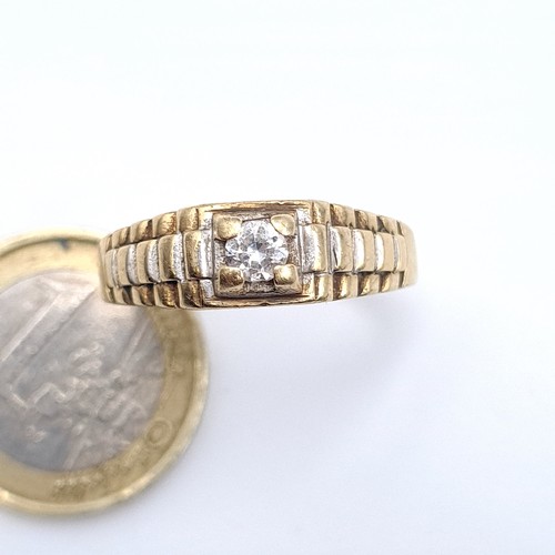 522 - Star Lot : A gents 9K gold cubic zirconia stone ring, size W, weight 3.7 grams.