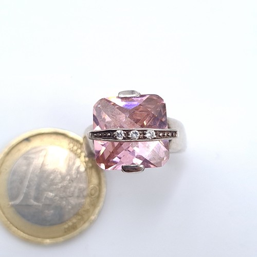 533 - A sterling silver pink facet cut gem stone ring with gem stone detailing, size M, weight 7.10 grams.... 