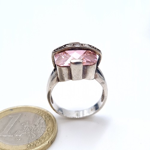 533 - A sterling silver pink facet cut gem stone ring with gem stone detailing, size M, weight 7.10 grams.... 