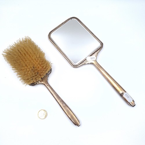 546 - Two attractive art deco sterling silver dressing table items. A machine cut mirror, dimensions 28cm ... 