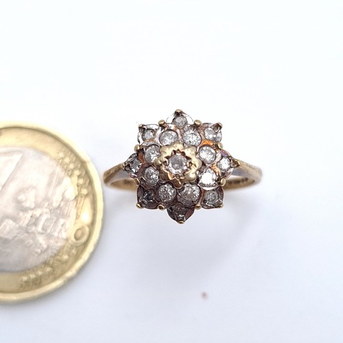 553 - A nice example of an antique diamond cluster set in 9K gold, size M, weight 2.35 grams.