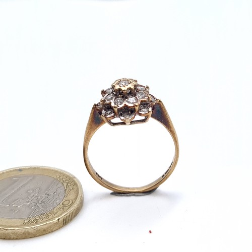 553 - A nice example of an antique diamond cluster set in 9K gold, size M, weight 2.35 grams.