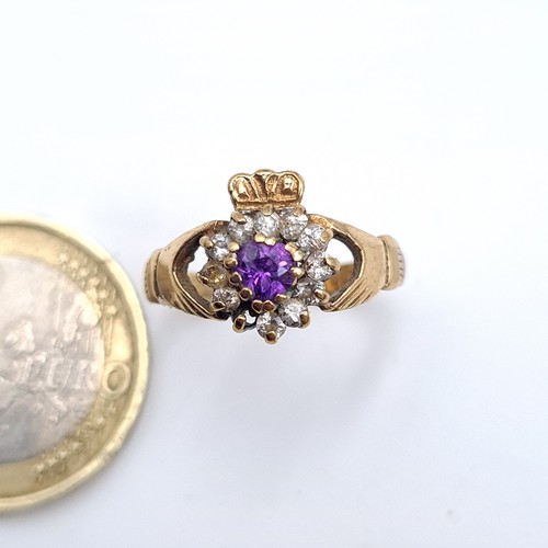 555 - A nice example of a 9K amethyst and gem stone claddagh ring(stone missing), ring size O, weight 2.05... 