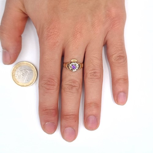 555 - A nice example of a 9K amethyst and gem stone claddagh ring(stone missing), ring size O, weight 2.05... 