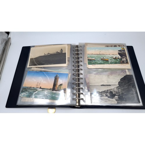 568 - An album containing photographs of Irish lighthouses together with some scenes of west Cork also an ... 