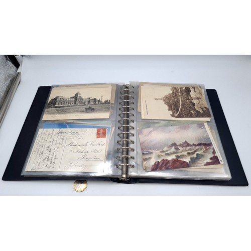 568 - An album containing photographs of Irish lighthouses together with some scenes of west Cork also an ... 