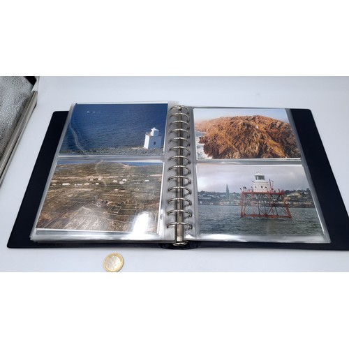 568 - An album containing photographs of Irish lighthouses together with some scenes of west Cork also an ... 