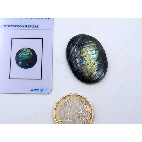 578 - Two natural stones the first an Labradorite of 39.20 carats together with a loose stone of artificia... 