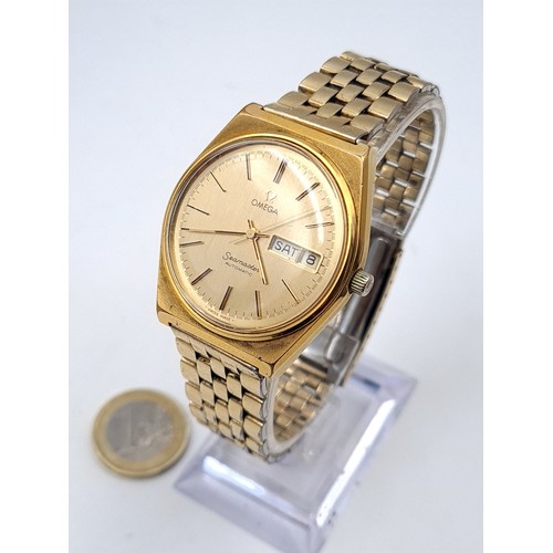 585 - Star Lot : A fine Omega vintage 1979 automatic wristwatch, set with gold metal case and dial with ba... 