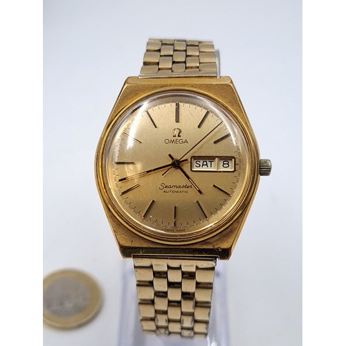 585 - Star Lot : A fine Omega vintage 1979 automatic wristwatch, set with gold metal case and dial with ba... 