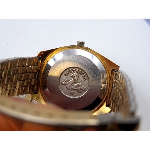 585 - Star Lot : A fine Omega vintage 1979 automatic wristwatch, set with gold metal case and dial with ba... 